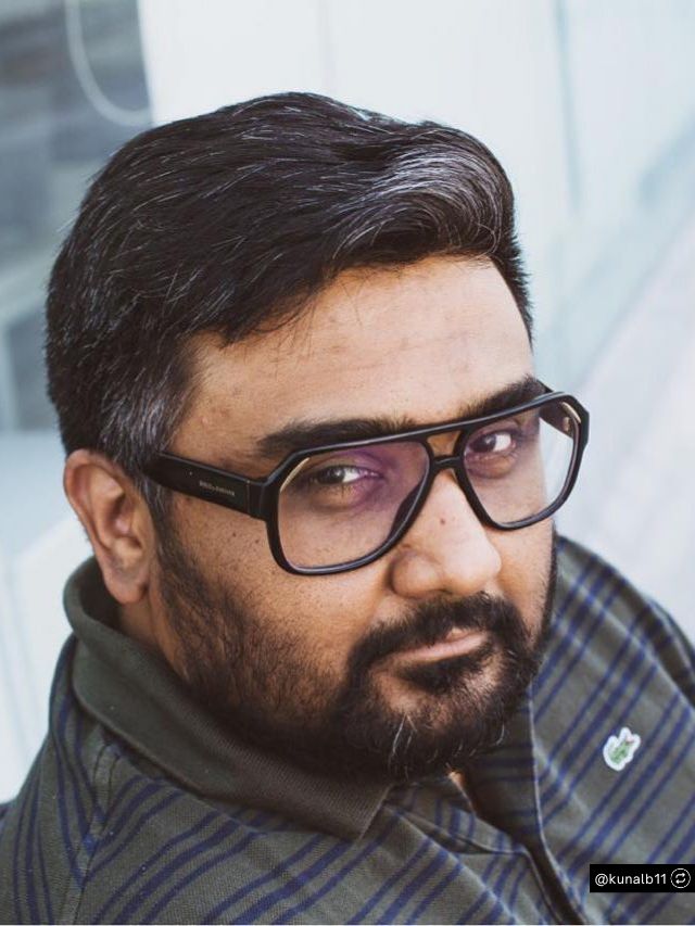 CRED Founder Kunal Shah Net Worth, Journey, Vision & Growth 2 Kunal Shah, the founder of CRED, looks thoughtfully into the camera while wearing stylish, thick-rimmed black glasses.